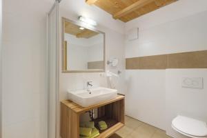 a bathroom with a sink and a toilet at Moarhof in Rosa +110 photos