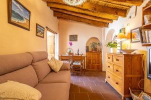 a living room with a couch and a table at Zarzamora de Rubite in Rubite +30 photos