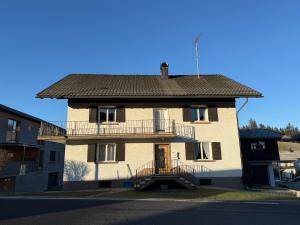 a house with a balcony on the side of it at Central Home in Krumbach in Krumbach