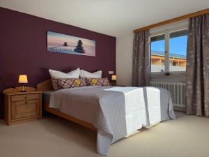 a bedroom with a white bed and a window at Central Home in Krumbach in Krumbach