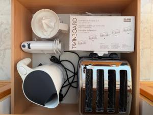 a box and a hair dryer in a drawer at Central Home in Krumbach in Krumbach