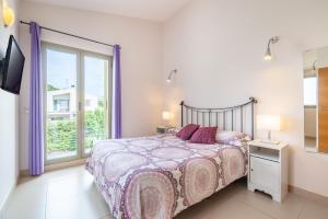 a bedroom with a bed and a large window at Astur - Moderno Chalet Con Piscina in Puigderrós +18 photos