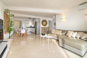 a living room with a couch and a table at La Perla vista al mar Fabiola 1 in Calpe