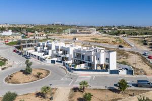 an aerial view of a large white apartment building at R-40-B Luxury Villa with pool in Los Montesinos