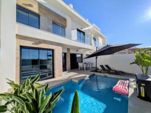 an image of a house with a swimming pool at R-40-B Luxury Villa with pool in Los Montesinos