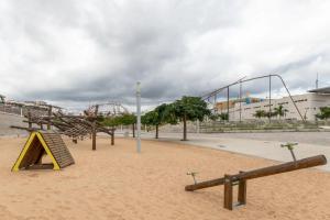 a park with a playground with a roller coaster at Ínsula Home in Tamaraceite