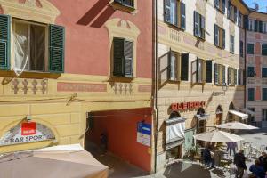 a group of people standing outside of a building at La Casa Del Marinaio in Rapallo