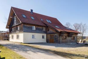 a large house with a brown roof at I'd Love To Be Home in Bidingen