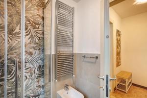 a bathroom with a shower and a sink at Maison de Doi - Chatillon in Châtillon +18 photos