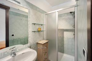 a bathroom with a sink and a shower at Casa Pepe in Imperia
