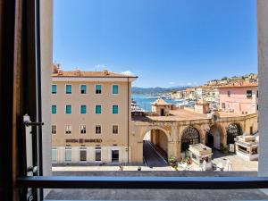 a view of a city from a window at Porta a Mare Home in Portoferraio
