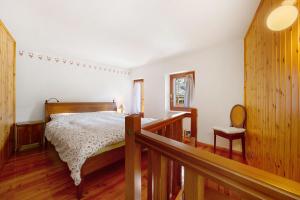 a bedroom with a bed and a desk in it at Casa Savin 35 in Pontboset
