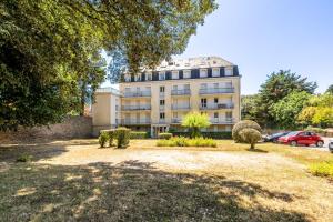 a building with a garden in front of it at Cap Sur L’océan - 481 in Pornic