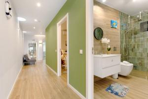 a bathroom with a shower and a sink and a toilet at O Marinheiro 15B in Machico
