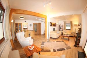 a living room with a couch and a table at Ferienhaus Da Vinci in Kirchheim