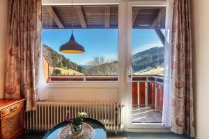 a window with a view of a mountain at Wohnung Claudia mit Balkon in Todtnau