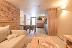 a living room with a couch and a table at Lisalice appartement in Les Villards-sur-Thônes