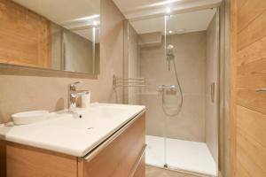 a bathroom with a sink and a shower at Lisalice appartement in Les Villards-sur-Thônes +15 photos