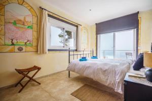 a bedroom with a bed and a window at Mediterranean Vacation in Mallorca in Cala Pi +28 photos