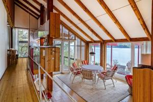 a kitchen and dining room with a table and chairs at Adlerhorst über dem Bodensee in Sipplingen
