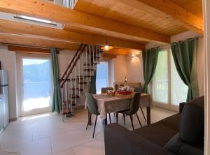 a dining room with a table and chairs at Alpi Liguri - Villa Giulia in Peveragno