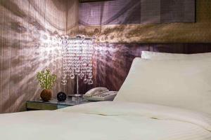 Postel nebo postele na pokoji v ubytování Hotel I Journey