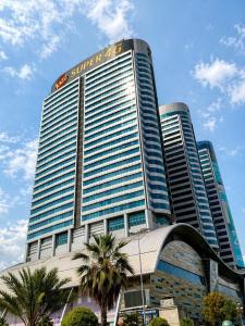 a building with a sign on the top of it at 1 Bedroom Apartment at Centaurus Mall in Islamabad