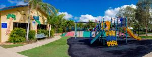a playground in a park with a slide at Discovery Parks - Ballina in Ballina