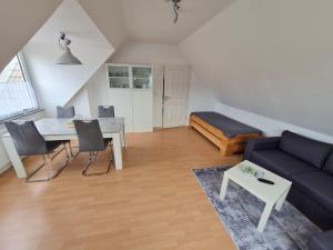 a living room with a couch and a table at Ferienwohnung Küstennest Vitzdorf in Fehmarn
