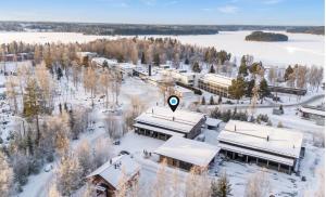 an aerial view of a campus in the snow at Villa West Ellivuori - High Quality 6BR Villa with Jacuzzi in Sastamala