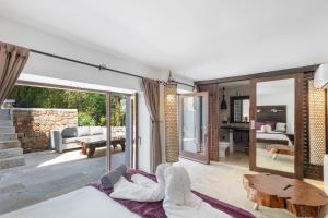 a living room with a couch and a table at Can Ribes Ibiza in Illes Balears