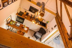 an overhead view of a living room with a table and chairs at Chalet Sternenzauber in Waasen