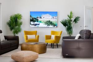 a living room with a couch and chairs and a table at Villa Mar y Muntana in Banyalbufar