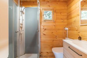 a bathroom with a shower and a toilet at Le Colibri in La Ciotat +19 photos