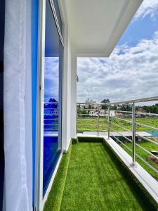a balcony with a view of the grass at Auryhomes in Mombasa