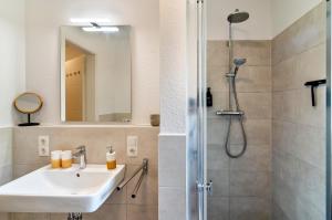 a bathroom with a sink and a shower at Fewo Luisa in Bad Zwischenahn
