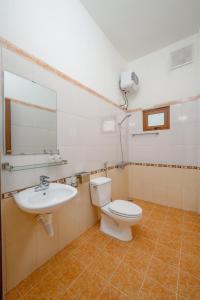 a bathroom with a toilet and a sink at South Star Hotel in Ninh Binh +27 photos
