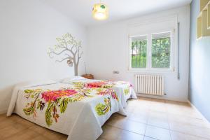 a bedroom with two beds and a window at Mario in Vinarós +21 photos