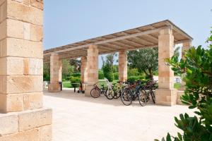 a group of bikes parked under a pavilion at Tenuta Vigna Corallo - Mimosa in Otranto