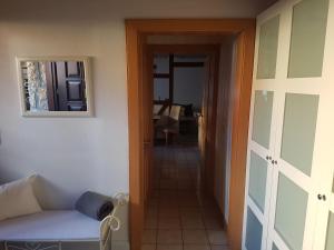 a living room with a couch and a window and a door at Ferienwohnung Reblaus in Markt Einersheim +18 photos