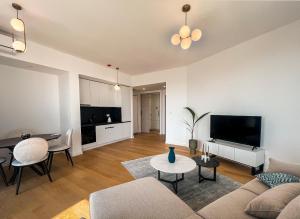 a living room with a couch and a table at Sobre Suites in Bečići