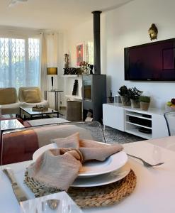 a living room with a table with a plate on it at El Escondrijo Ibiza in San Antonio