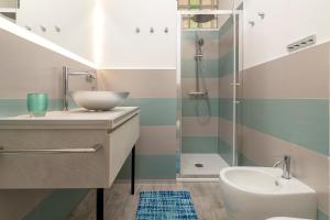 a bathroom with a sink and a shower at Thomas' House in Alghero +21 photos