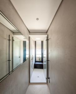 a hallway of a house with a mirror at Stilla, San Mikiel in Senglea