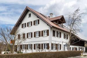 a white house with a red roof at Apfelhof Maurer in Lindau