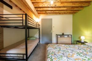 a bedroom with two bunk beds in a room at Les Bellevues in Moye +35 photos