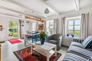 a living room with a couch and a table at Mein Haus in Pellworm