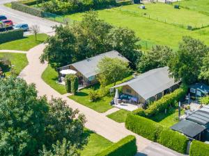 an aerial view of a farm with a building at Camping 7Huizen aan Zee in Scharendijke