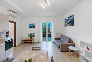 a living room with a couch and a table at Casa Vacanza Anni' in Vico Equense