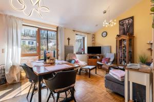 a large living room with a table and chairs at all u need 4 holiday - fewo44 in Mühlthal